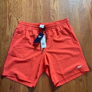 Men’s Reebok athletic shorts, Side pockets, Size L, color Orange, NWT